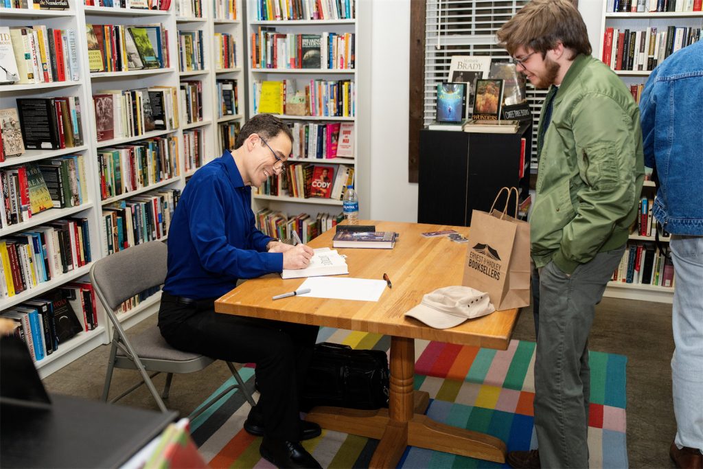 Seth Panitch signing his book Antique